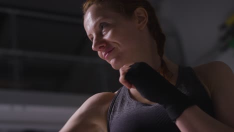 Close-Up-Shot-Of-Mature-Woman-Wearing-Gym-Fitness-Clothing-Exercising-Sparring